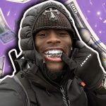 A photo of Kai Cenat showing off his grills.