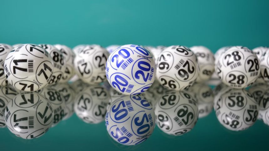 White lottery ball spread out on glass table